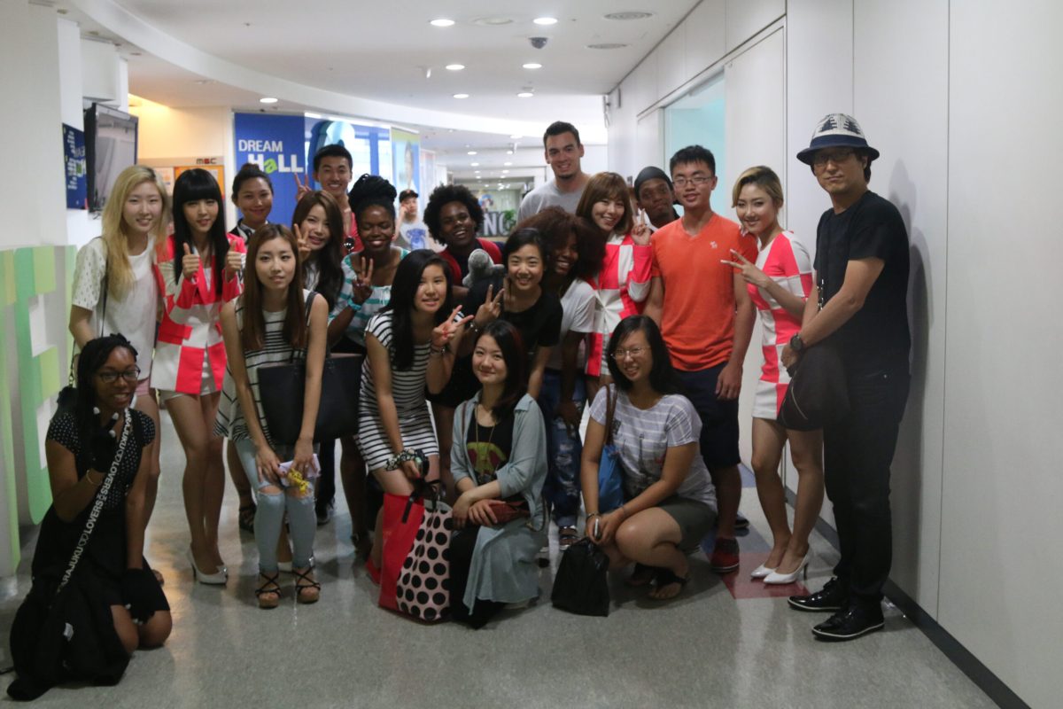 Students posing with Kpop girl group