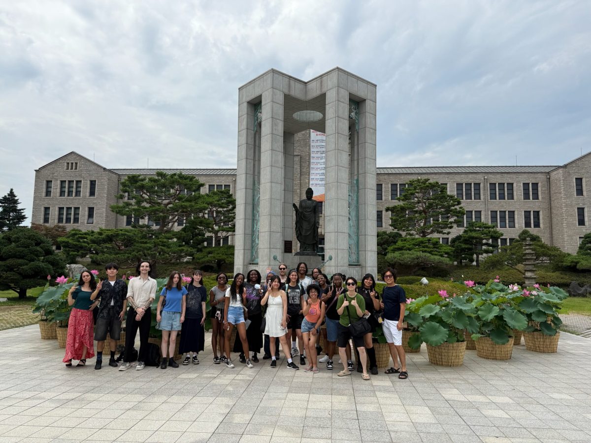 Student a front of Dungguk's Noble Eightfold Path statue