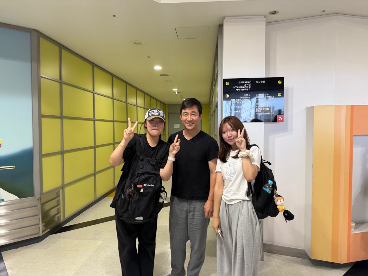 Korean students taking a photo with a famous actor