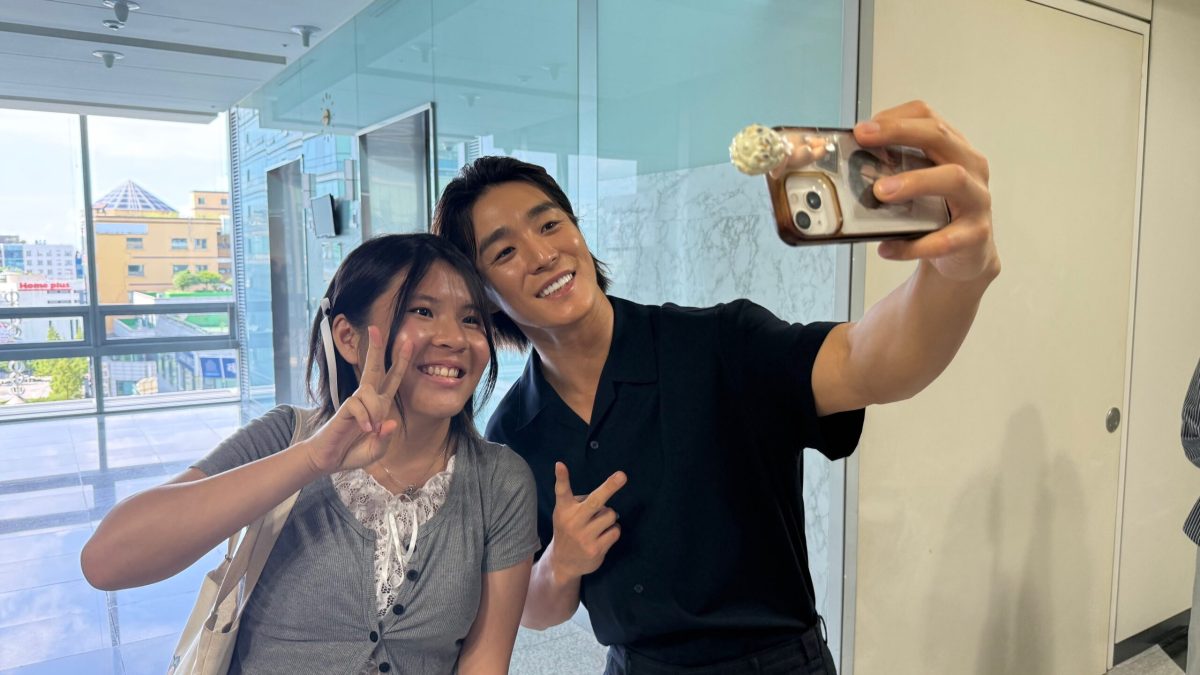 Student taking a photo with a up and coming K drama star