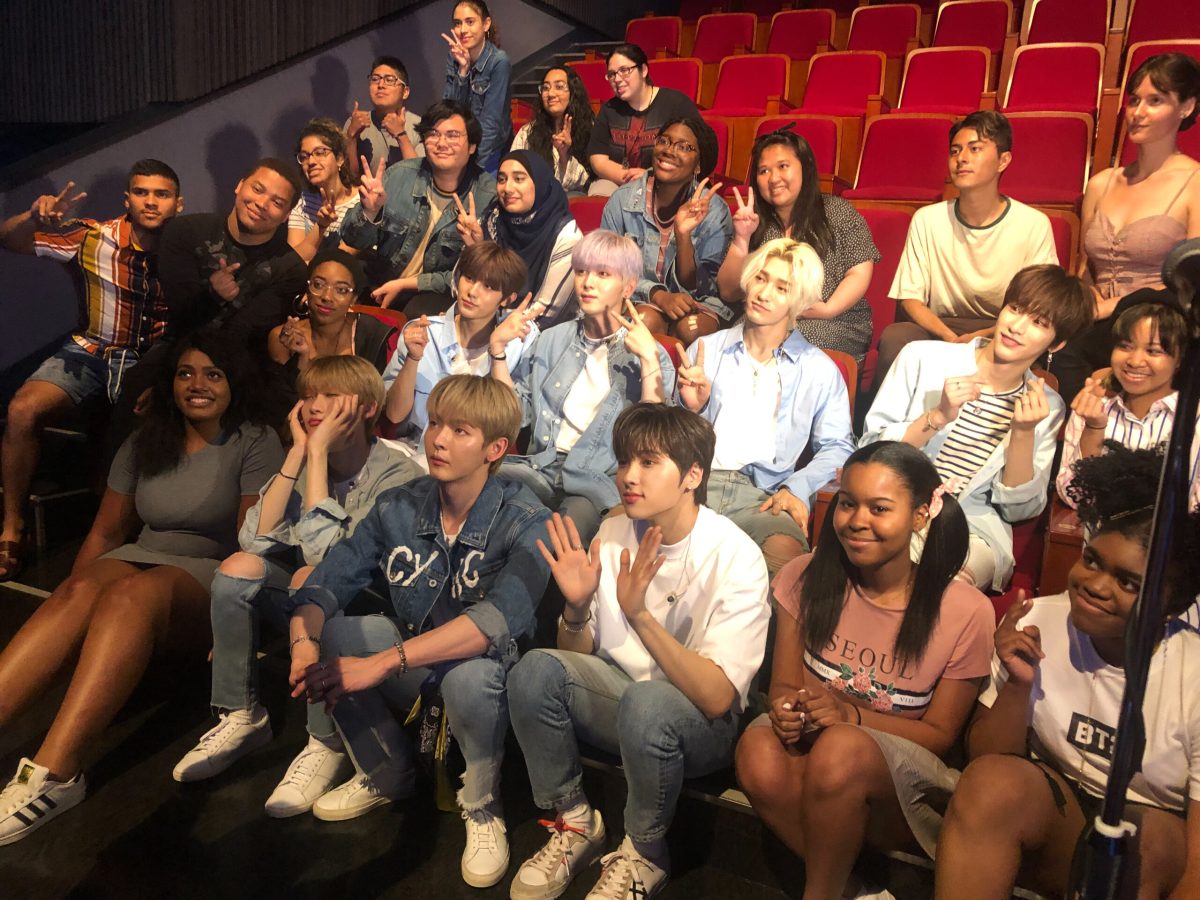 Students posing with kpop idols